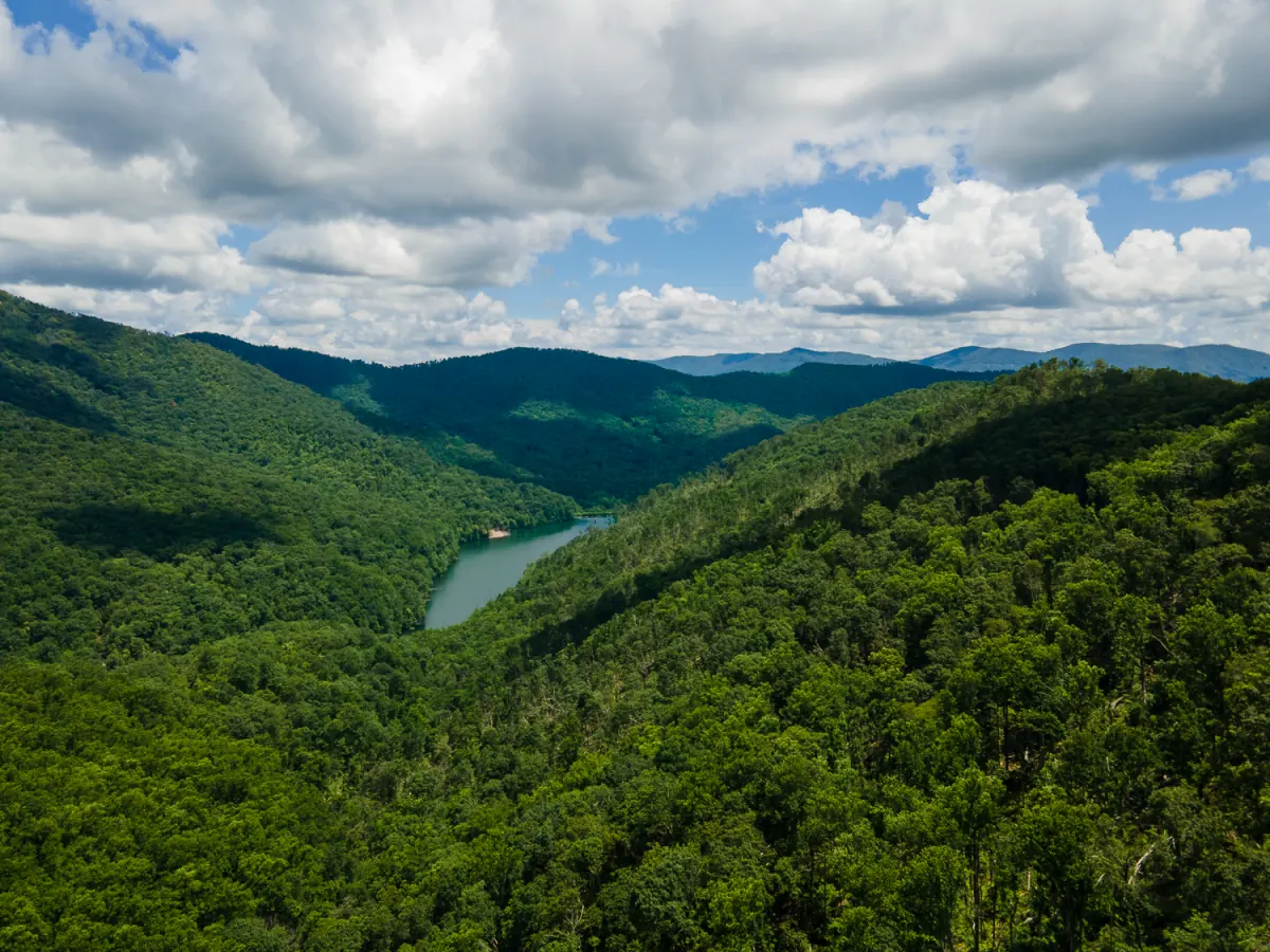 Swannanoa carpenter Rob Stimson's home ground: drone view of wooded mountain ridges and a reservoir in Swannanoa, NC
